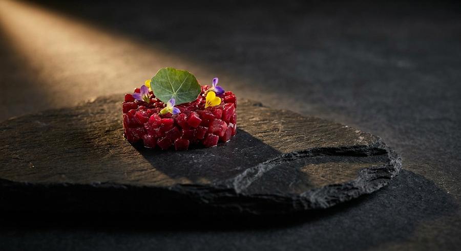 Beetroot tartare amuse-bouche on slate
